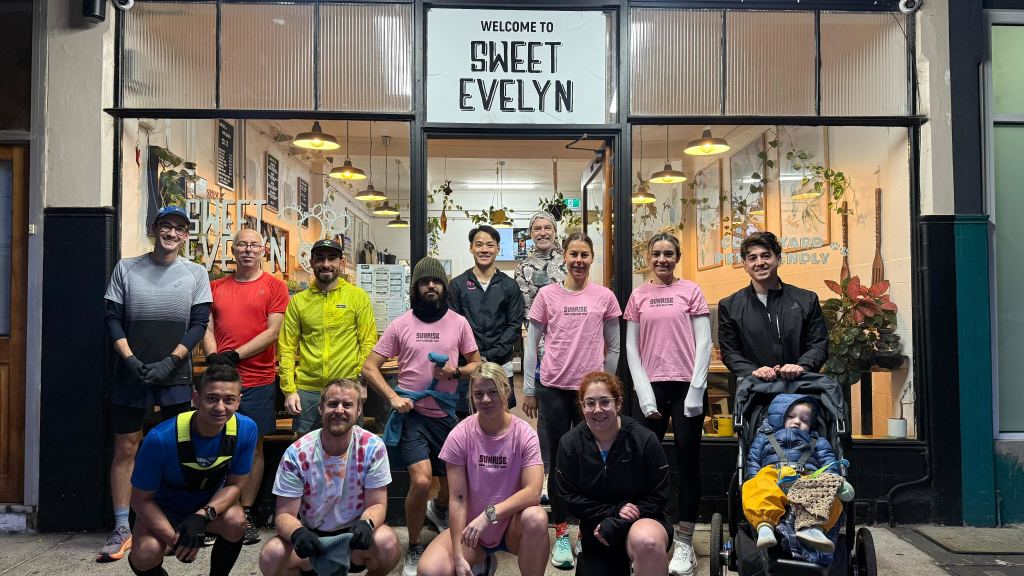 Sunrise Long Run Melbourne group outside Sweet Evelyn Café in Brunswick before their weekly Sunday morning run.